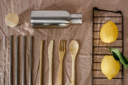 A flat lay of eco-friendly utensils with lemons, emphasizing sustainable living.